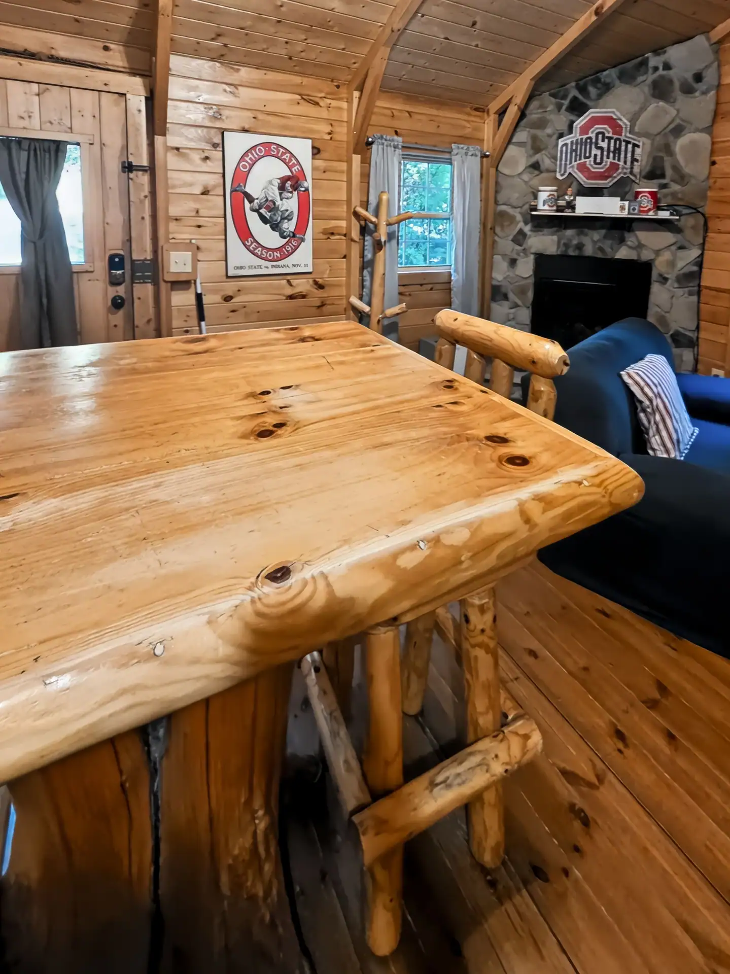 Handmade log table with log bar stools in the living area at Buckeye Hut cabin