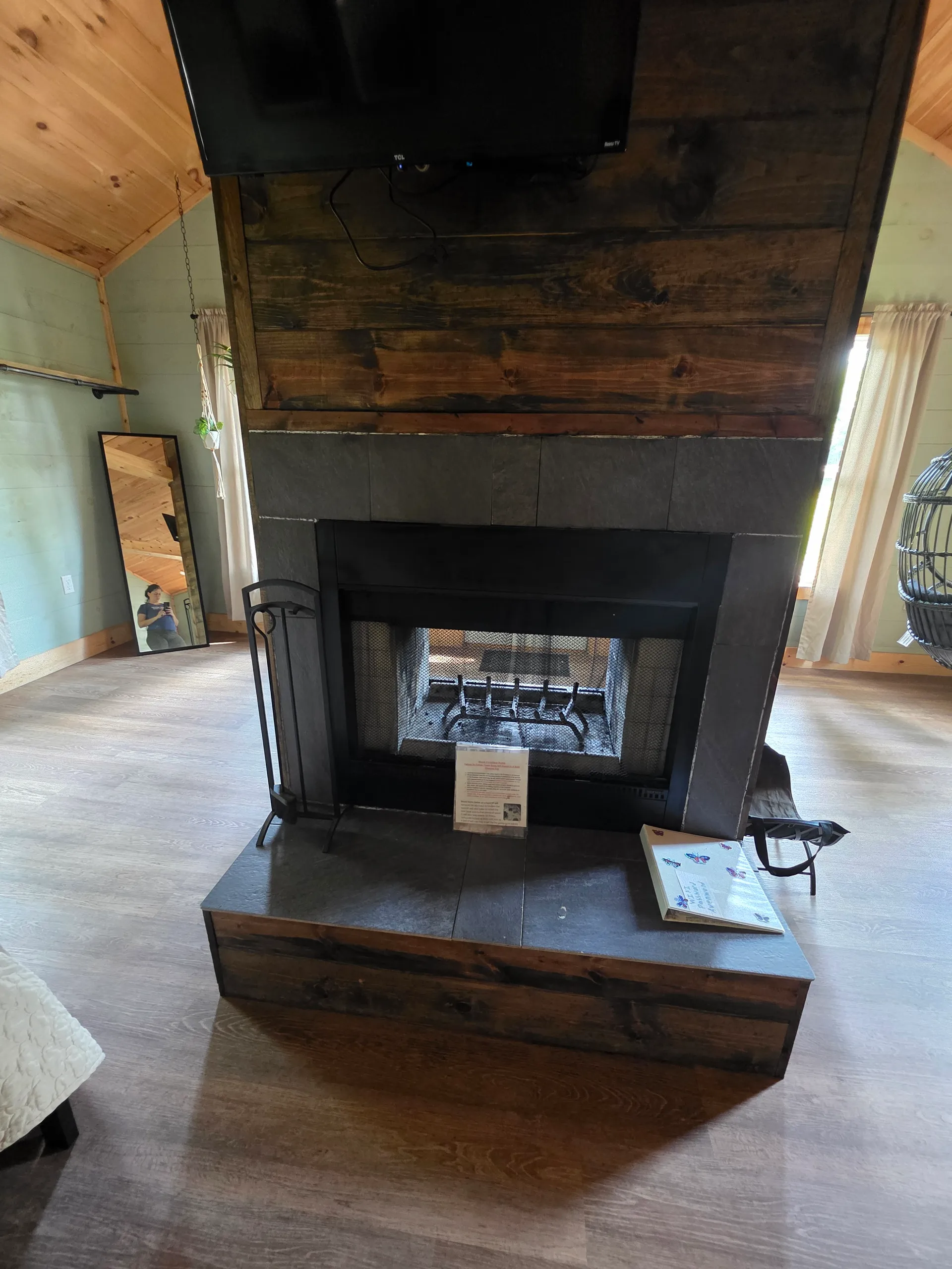 Wine glasses and coffee mugs on floating wood shelves at Butterfly Ridge cabin