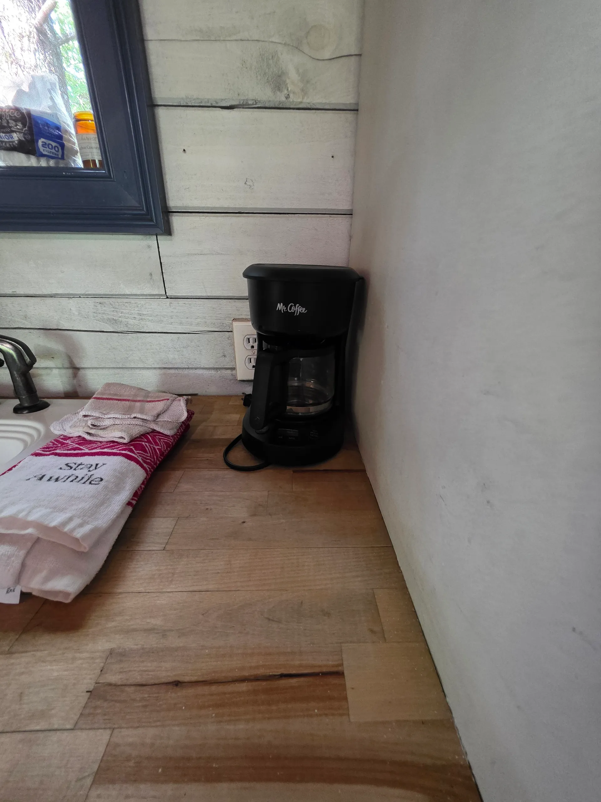 Coffee maker and kitchen counter amenities in Eagles Nest cabin