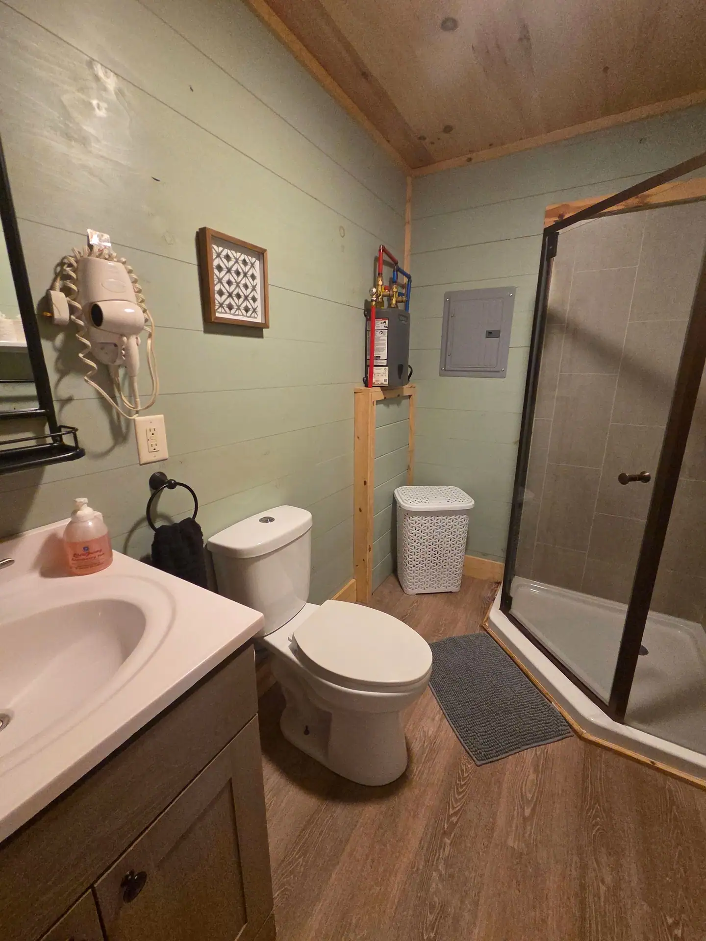 Bathroom with vanity, toilet and glass walk-in shower at Firefly's Landing