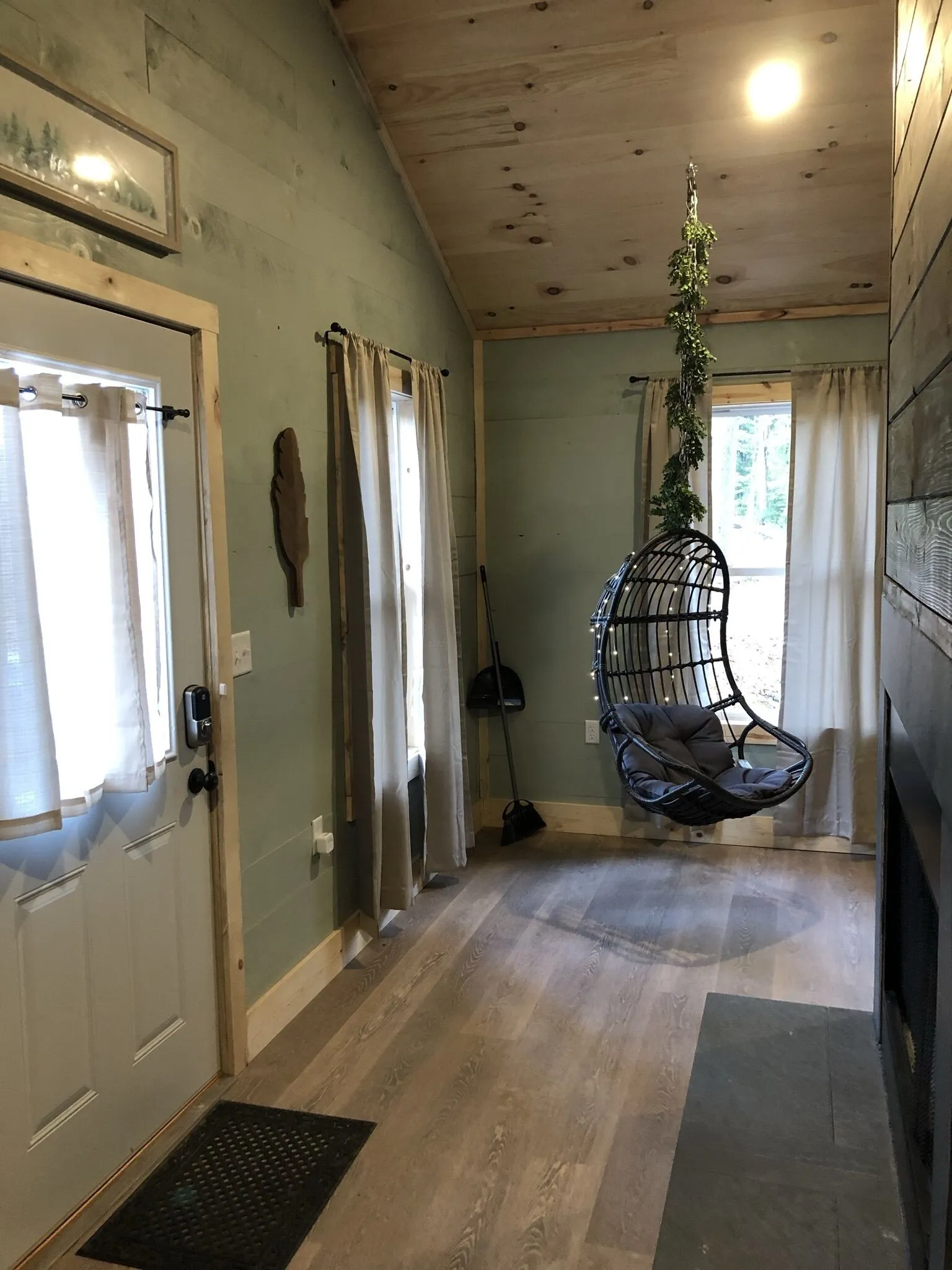Glass-enclosed walk-in shower with gray tile in the bathroom at Firefly cabin