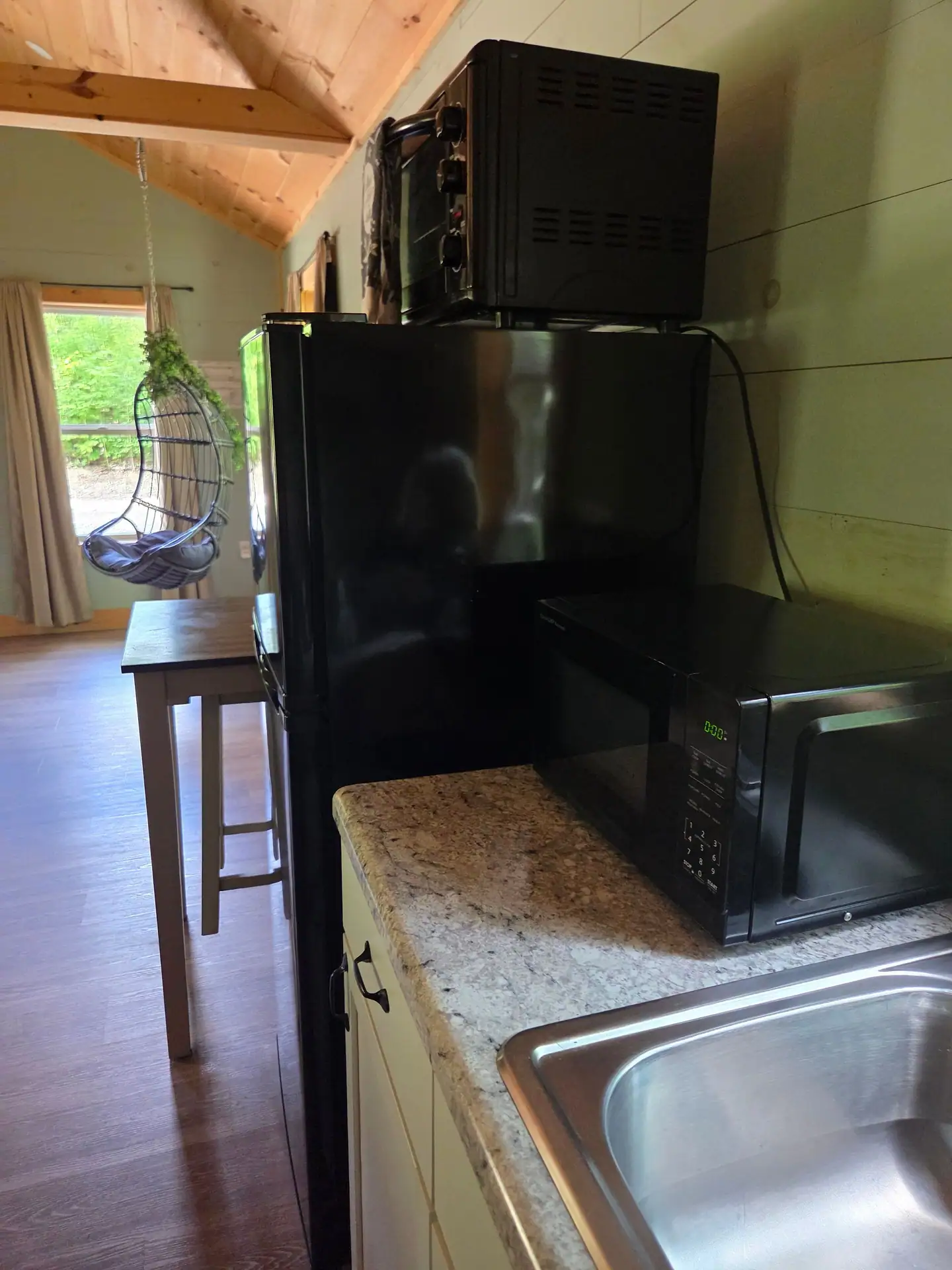 Kitchenette with fridge, microwave, toaster oven and sink at Firefly's Landing