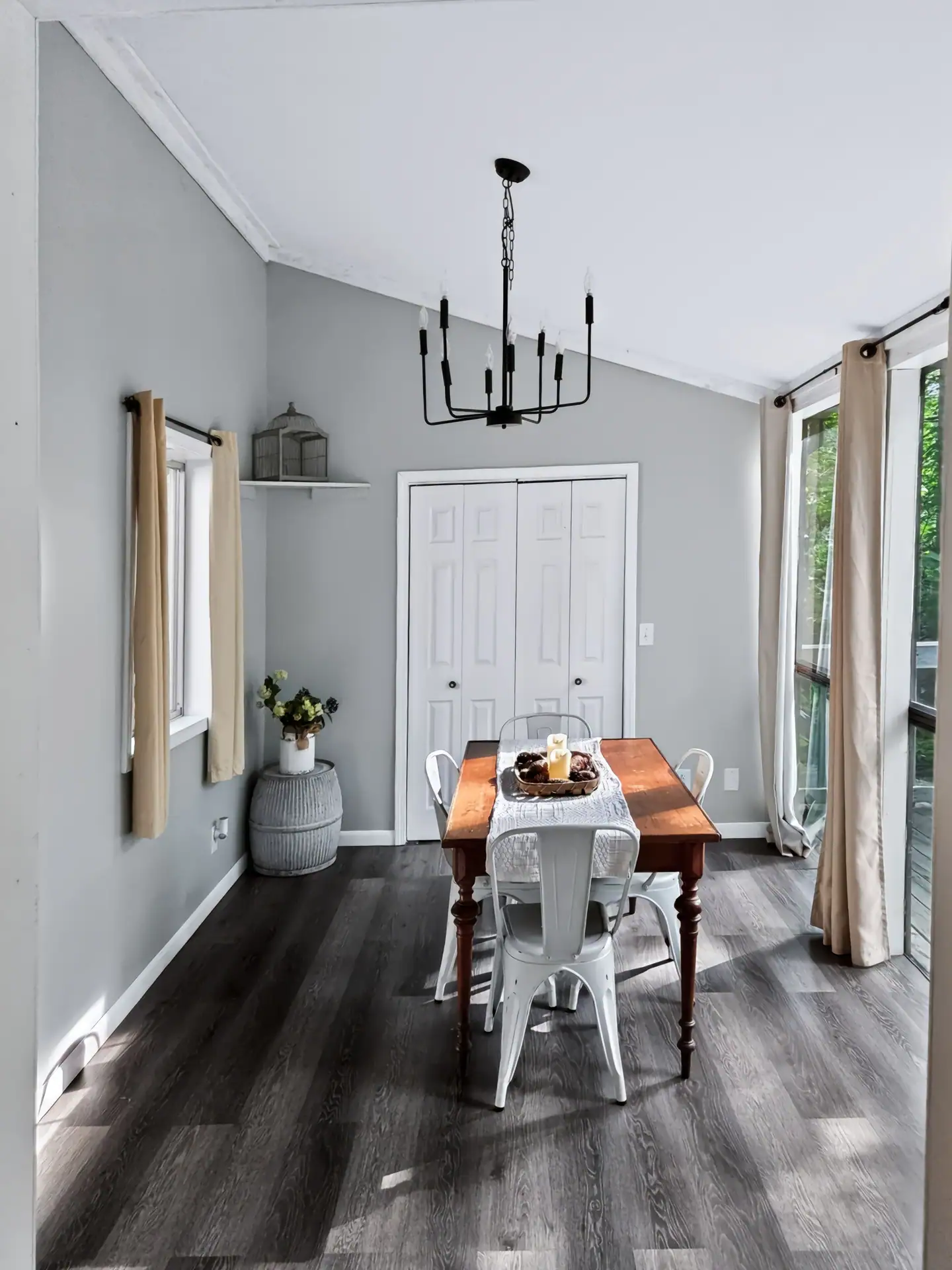 Farmhouse dining table with white metal chairs at The Getaway House.