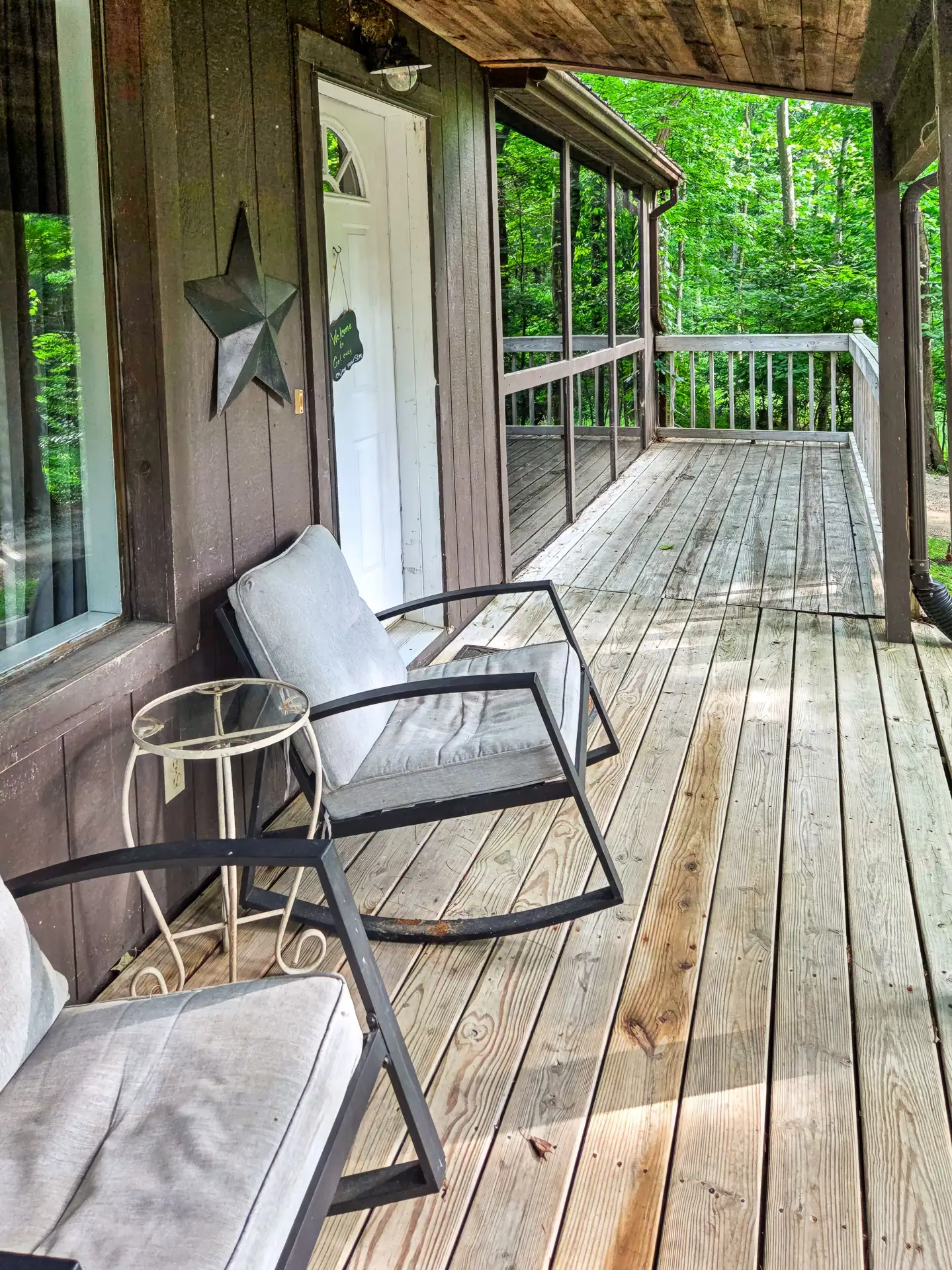 Rocking chairs beside the front door on the covered porch of The Getaway House.