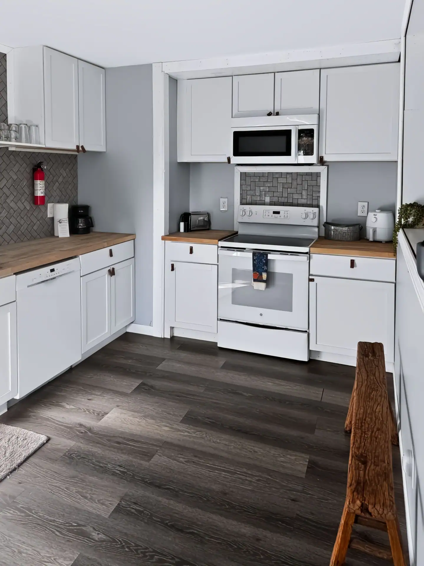 Full kitchen at The Getaway House with a dishwasher, stove and plenty of counter space.