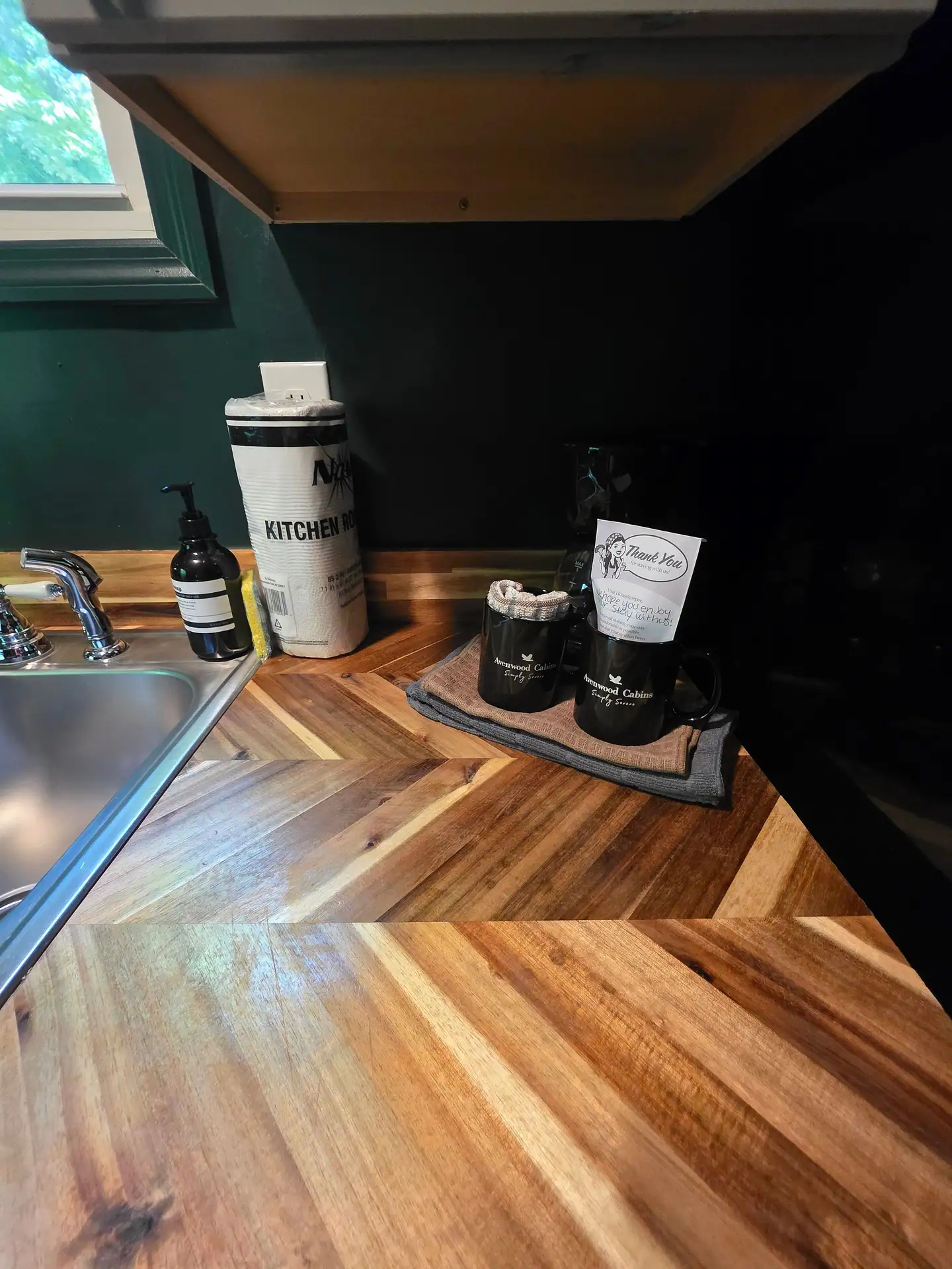 Herringbone wood countertop with coffee station at The Old Moonshiner cabin