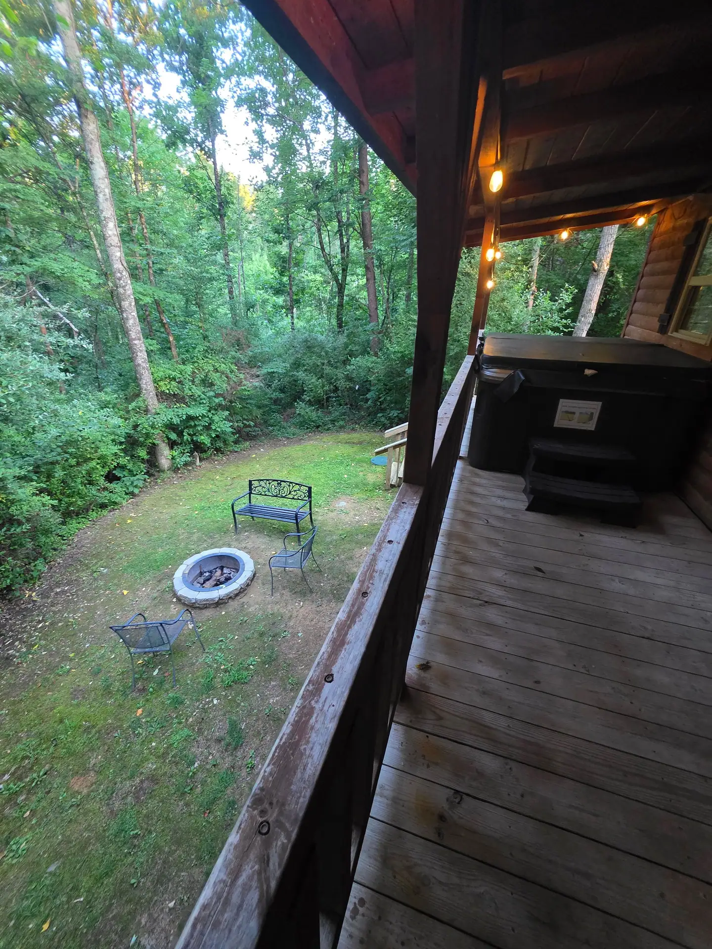 View from the Whippoorwill deck down to the fire pit and the woods