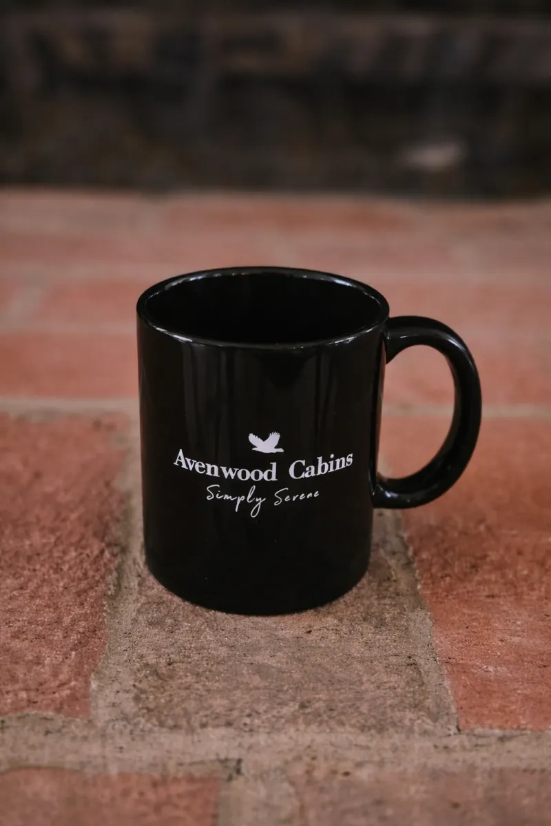 An etched Avenwood Cabins coffee mug